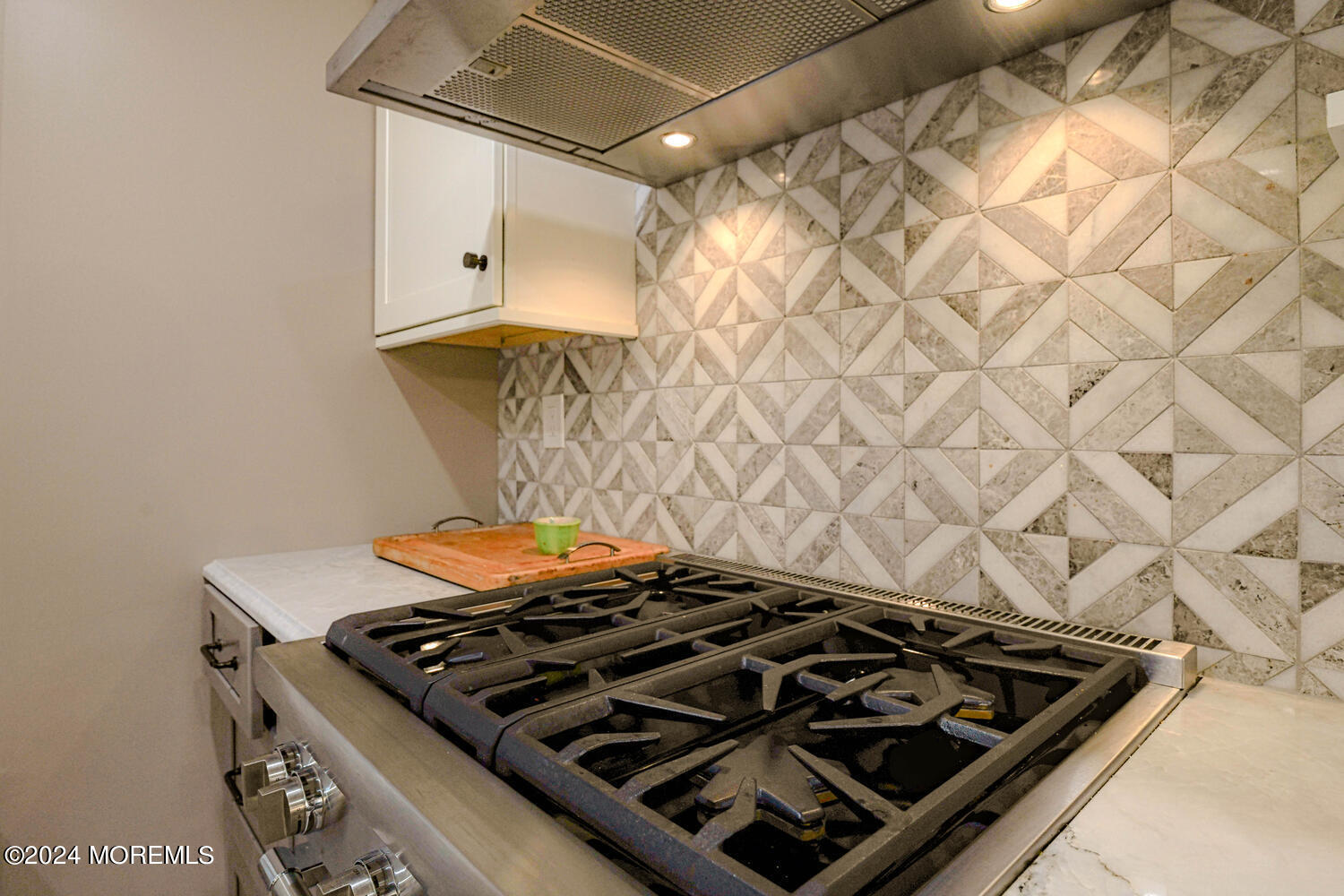 83 Broadway Ocean Grove, NJ 07756 - Photo 24 of 40 a close up of a stove in a kitchen