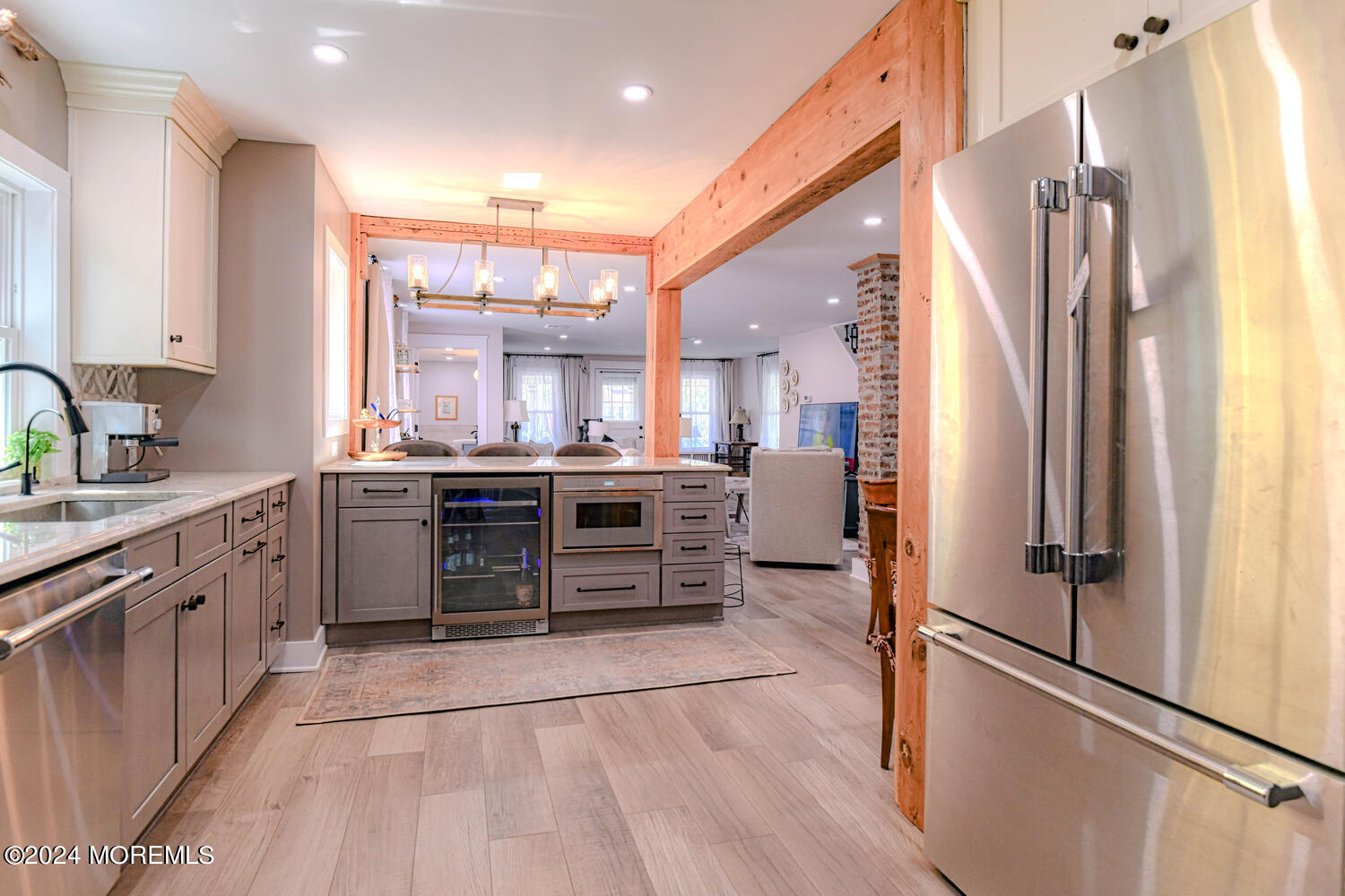 83 Broadway Ocean Grove, NJ 07756 - Photo 25 of 40 a kitchen with stainless steel appliances a refrigerator sink and cabinets