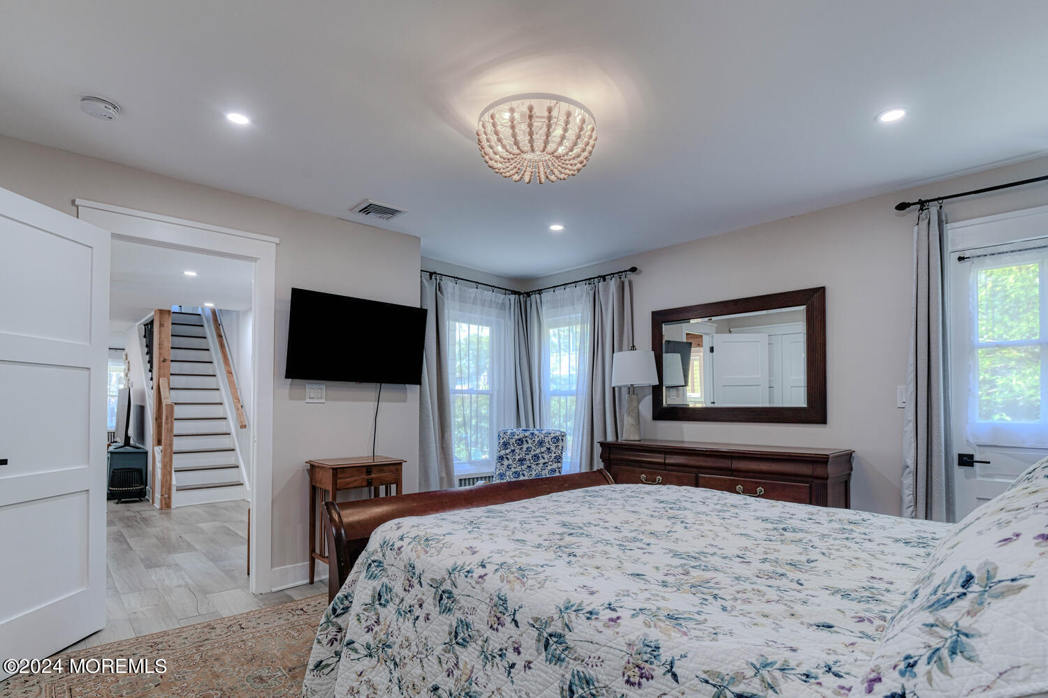 83 Broadway Ocean Grove, NJ 07756 - Photo 27 of 40 a bedroom with a bed and a flat screen tv