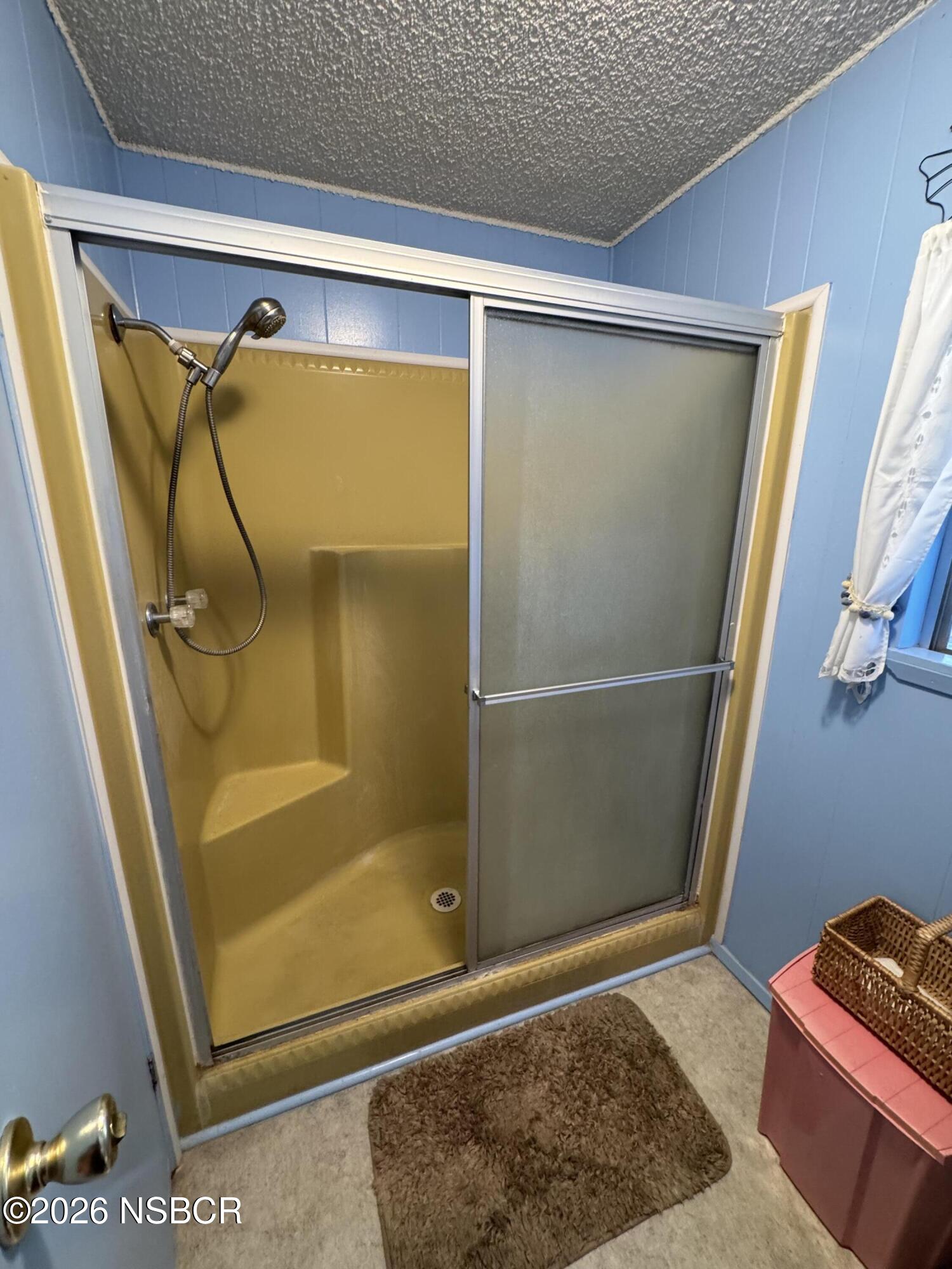 3210 Santa Maria Way, Unit 173 Santa Maria, CA 93455 - Photo 17 of 24 a bathroom with a glass shower door