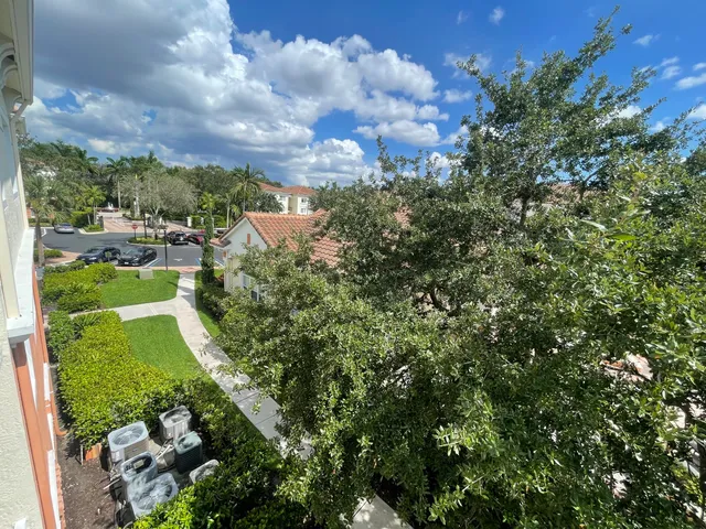 a view of a garden with buildings