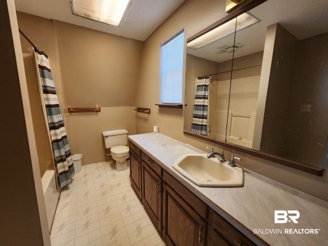 32749 Antietam Road Lillian, AL 36549 - Photo 28 of 47 Full bathroom featuring vanity, toilet, and shower / tub combo