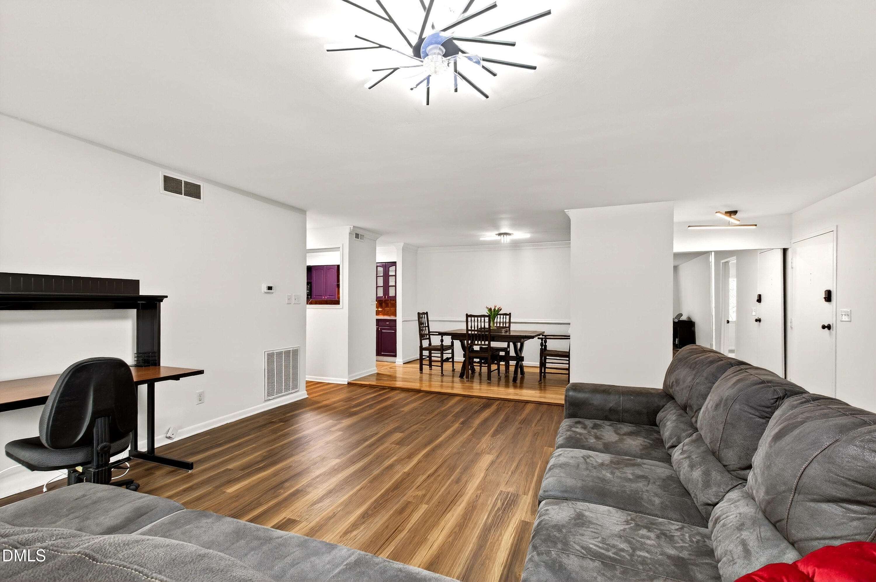 4507 Edwards Mill Road, Unit G Raleigh, NC 27612 - Photo 1 of 19 a living room with furniture and a chandelier