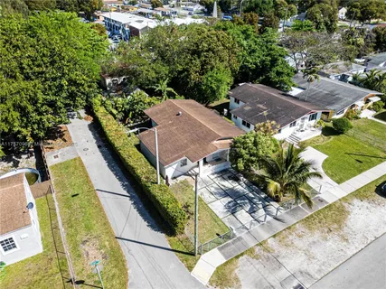 an aerial view of a house with swimming pool