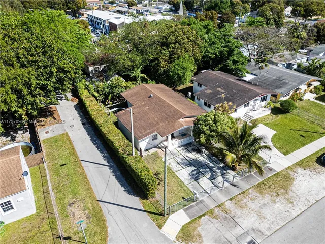an aerial view of a house with swimming pool
