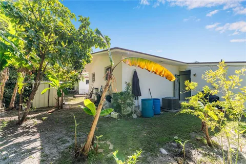 a backyard of a house with lots of green space