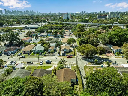 an aerial view of residential house with outdoor space and parking