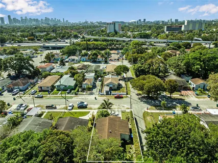 an aerial view of residential house with outdoor space and parking