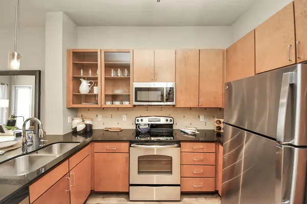 a view of a couches and table in kitchen