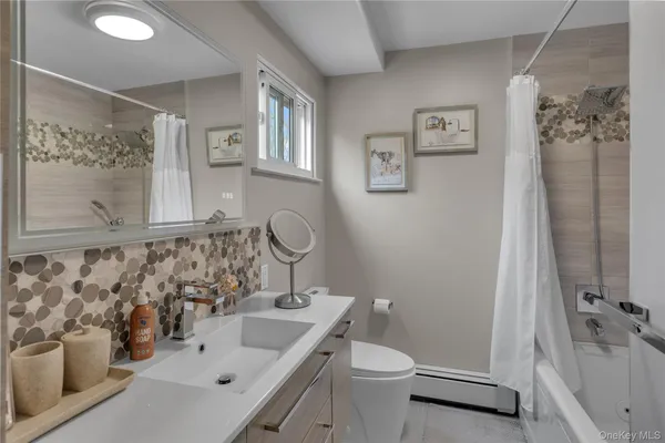 a bedroom with a large bed and a large window