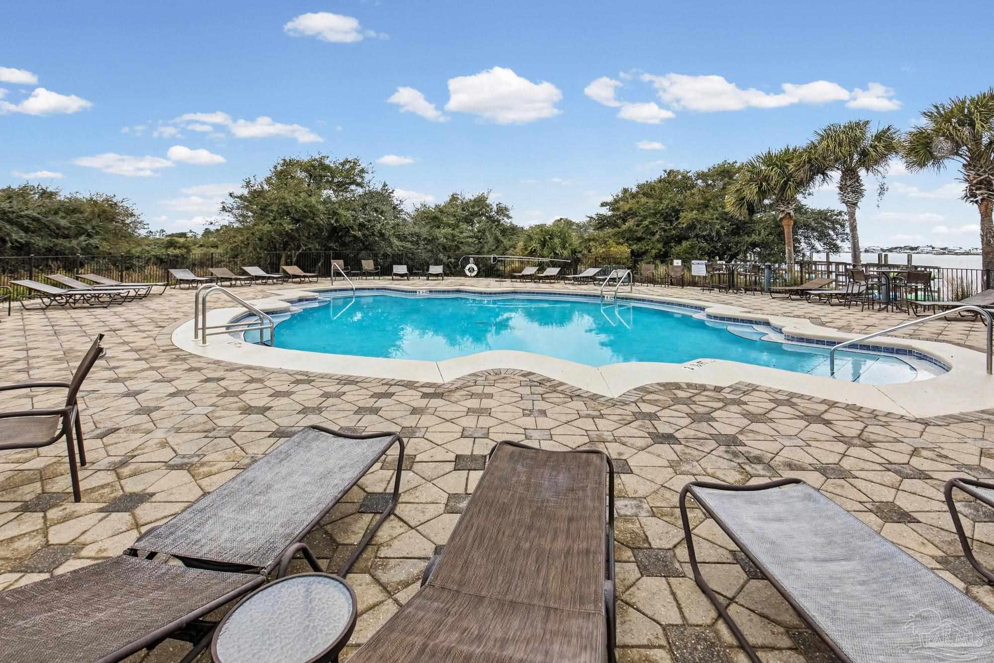 14900 River Road, Unit 904 Perdido Key, FL 32507 - Photo 53 of 62 a view of a swimming pool with lounge chair