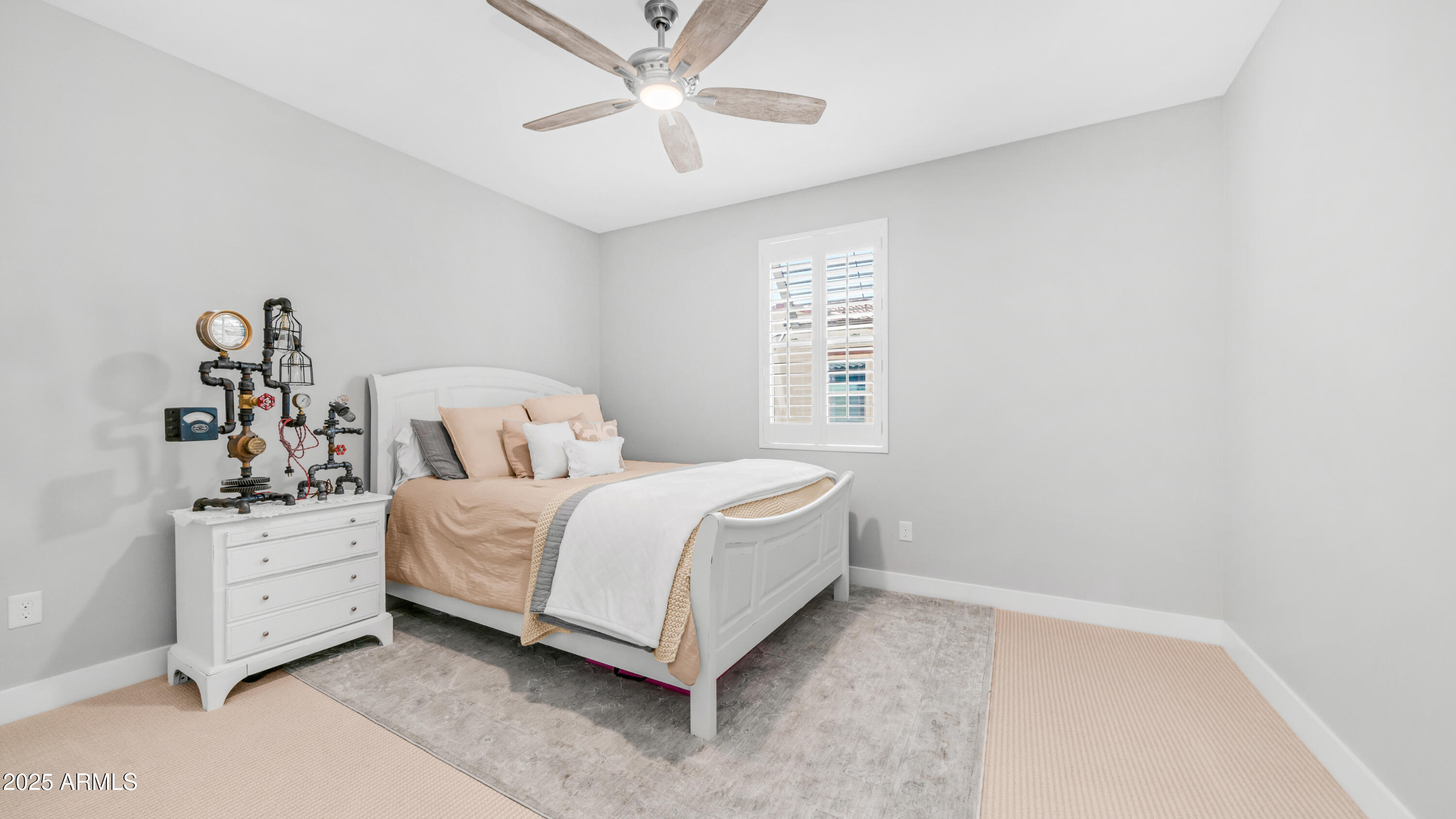 3855 South McQueen Road, Unit 60 Chandler, AZ 85286 - Photo 23 of 43 a bed room with a bed and a chandelier
