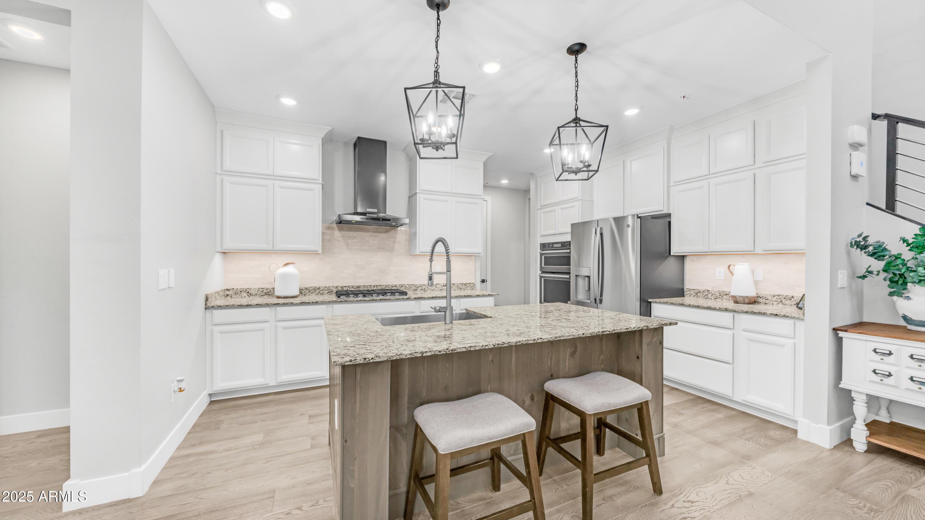 3855 South McQueen Road, Unit 60 Chandler, AZ 85286 - Photo 3 of 43 a kitchen with stainless steel appliances kitchen island granite countertop a sink a stove a dining table and chairs