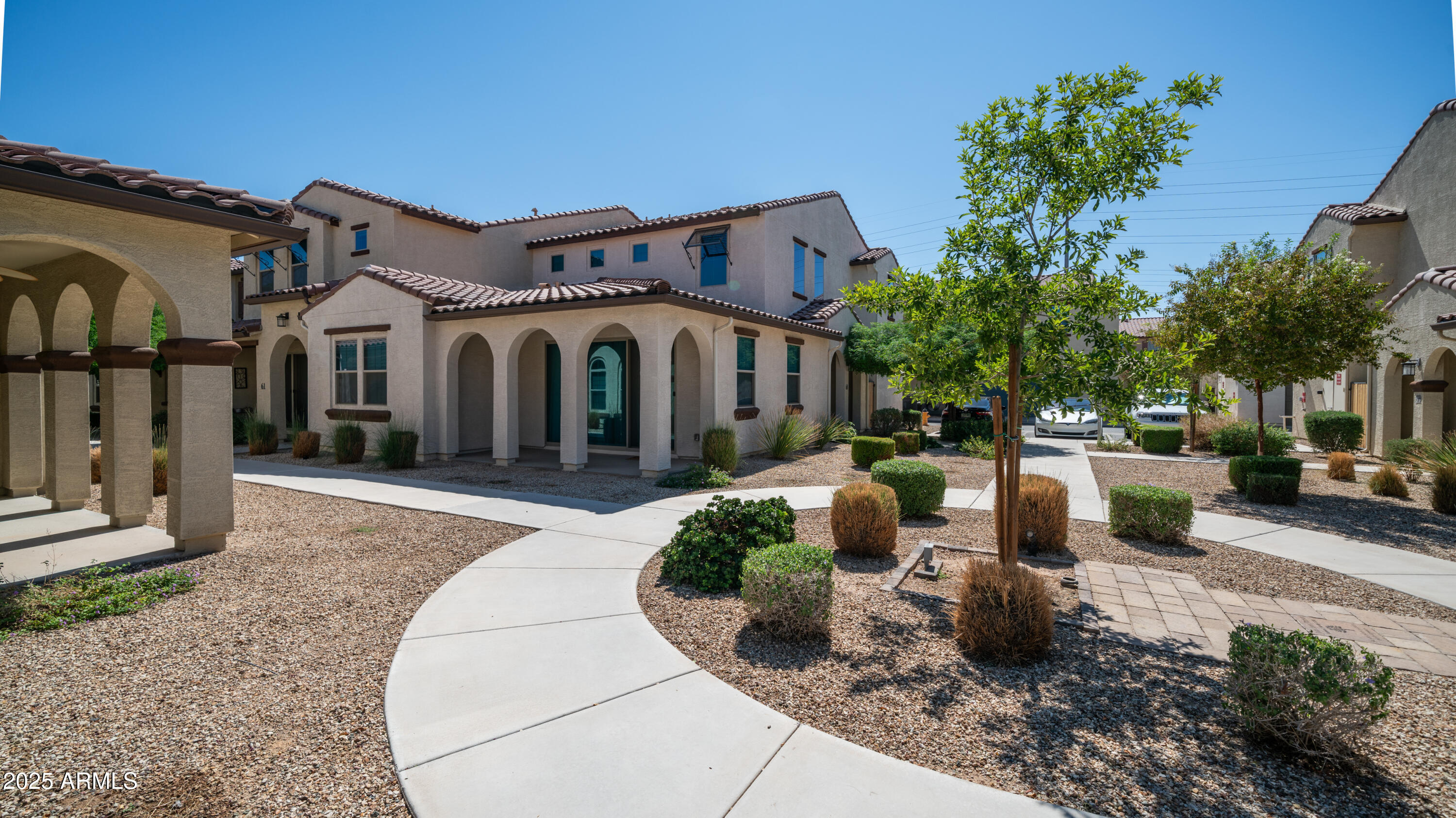 3855 South McQueen Road, Unit 60 Chandler, AZ 85286 - Photo 32 of 43 a front view of a house with garden