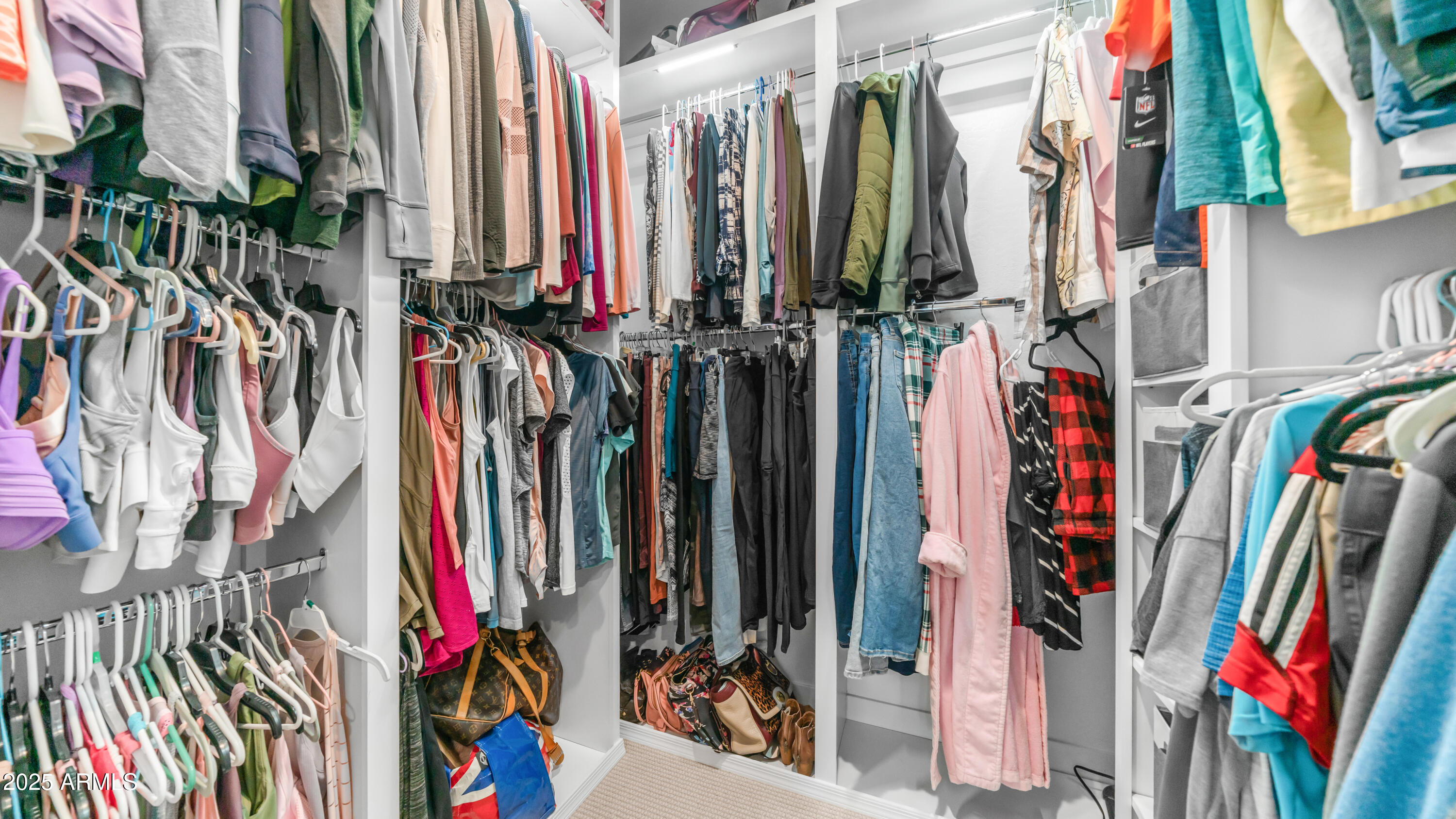 3855 South McQueen Road, Unit 60 Chandler, AZ 85286 - Photo 37 of 43 a view of walk in closet with clothes