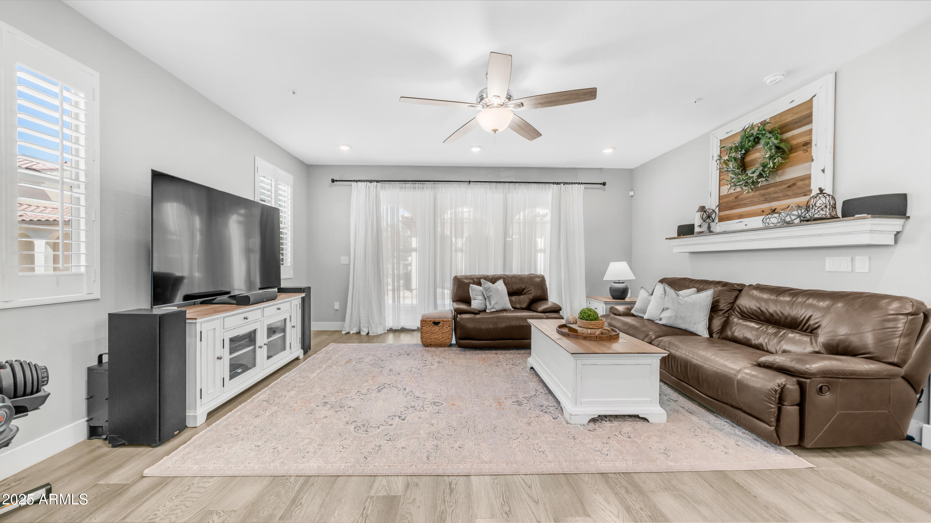 3855 South McQueen Road, Unit 60 Chandler, AZ 85286 - Photo 7 of 43 a living room with furniture and a flat screen tv