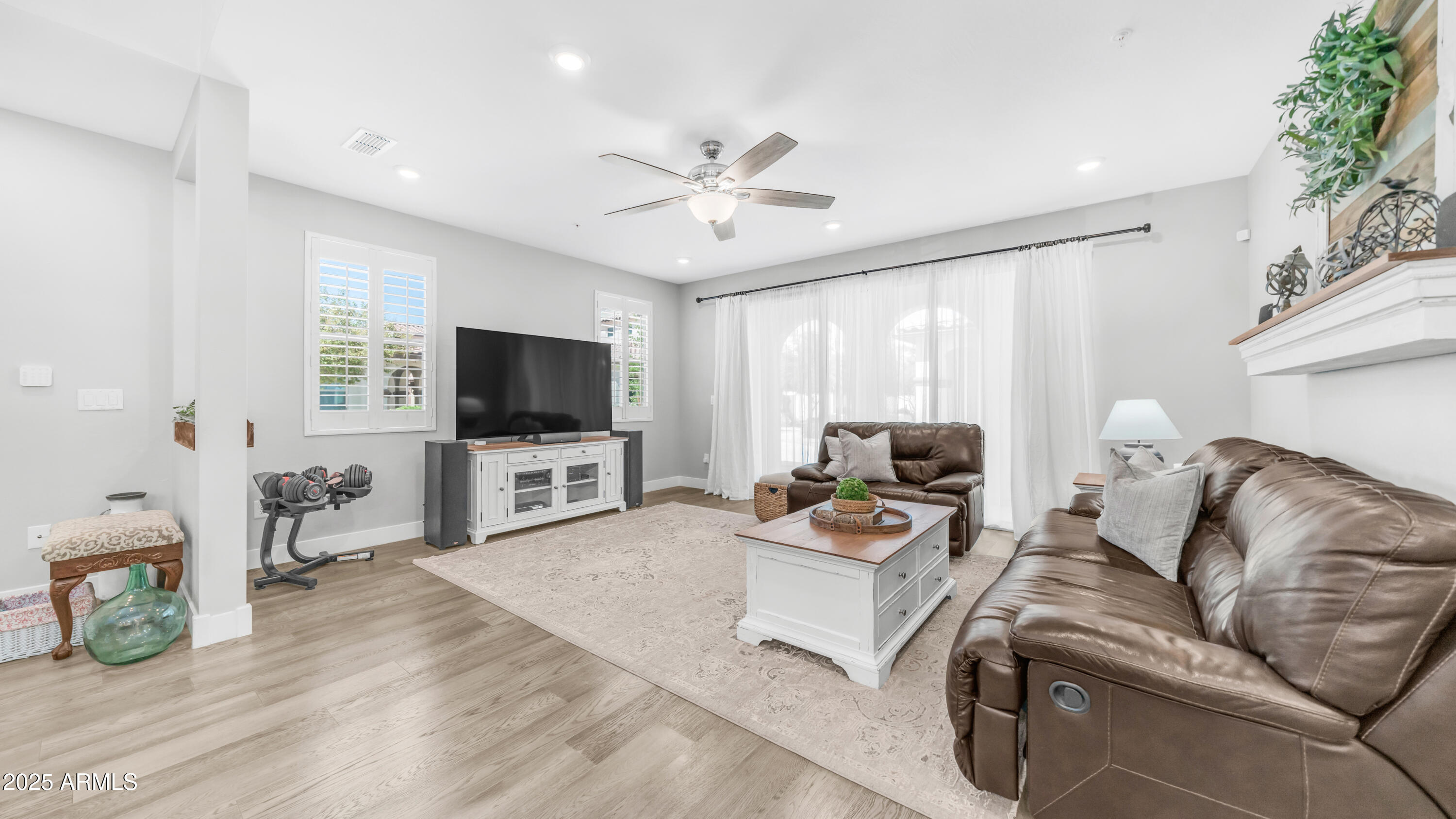 3855 South McQueen Road, Unit 60 Chandler, AZ 85286 - Photo 8 of 43 a living room with furniture and a flat screen tv
