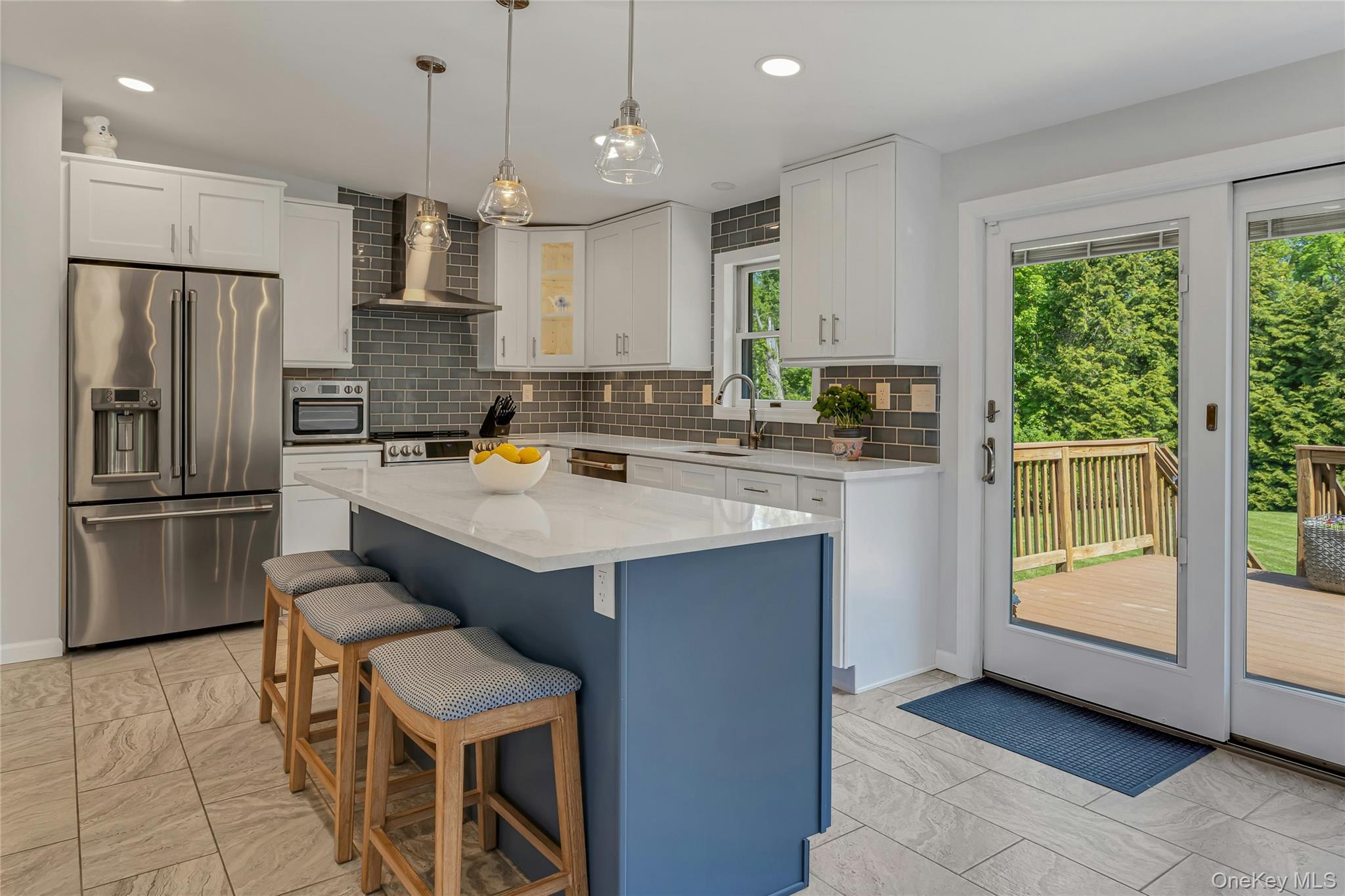 340 Osceola Road Jefferson Valley, NY 10535 - Photo 15 of 48 a kitchen with a sink a counter top space stainless steel appliances and a window