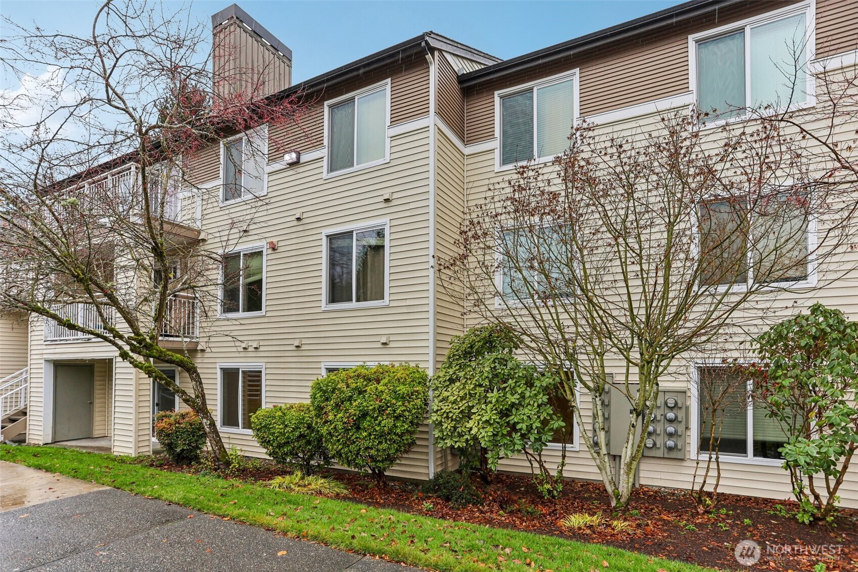 12303 Harbour Pointe Boulevard, Unit W101 Mukilteo, WA 98275 - Photo 1 of 25 a view of a white house next to a yard
