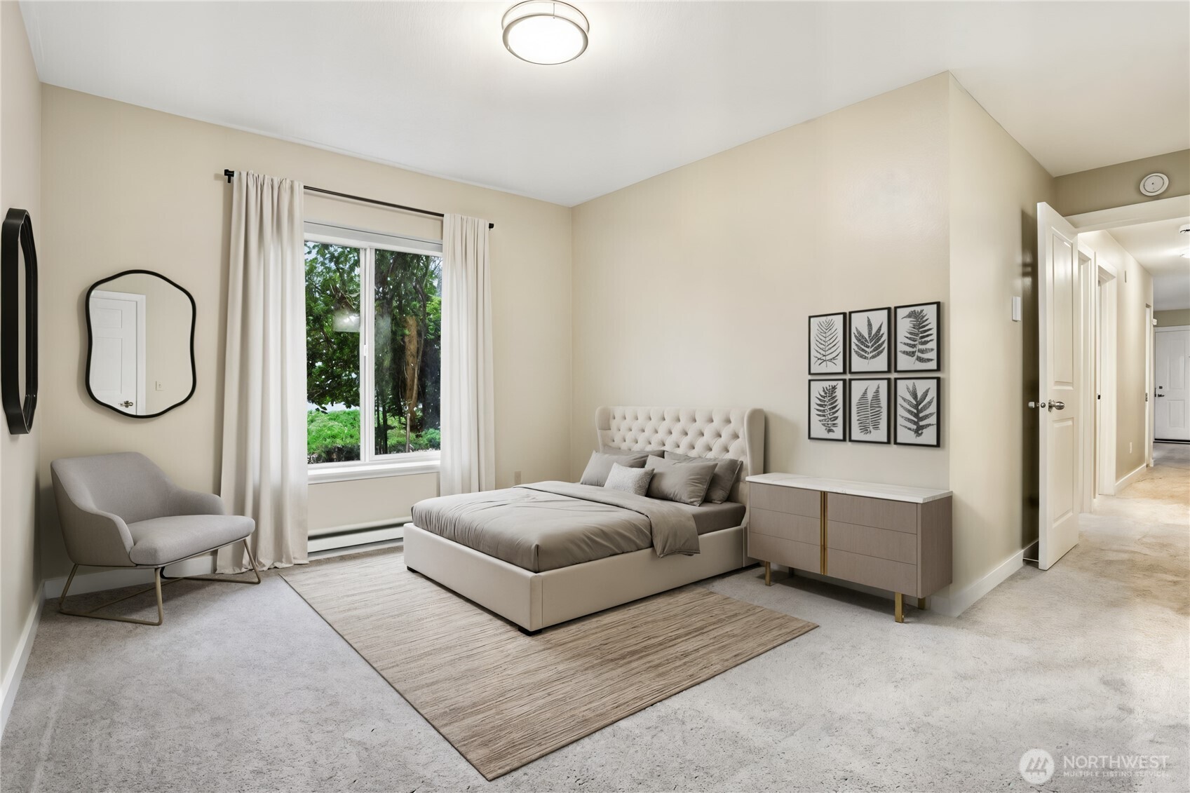 12303 Harbour Pointe Boulevard, Unit W101 Mukilteo, WA 98275 - Photo 13 of 25 a living room with furniture gym equipment and a large window