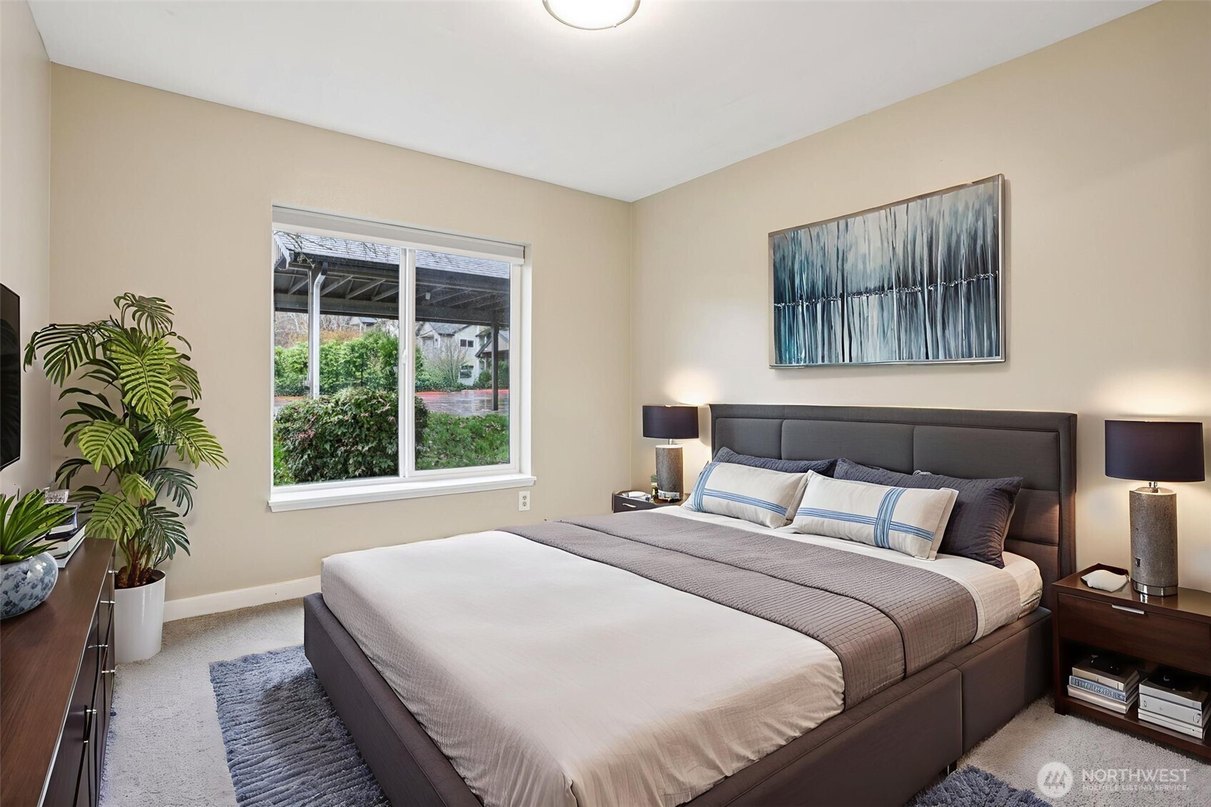 12303 Harbour Pointe Boulevard, Unit W101 Mukilteo, WA 98275 - Photo 19 of 25 a bedroom with bed and a large window