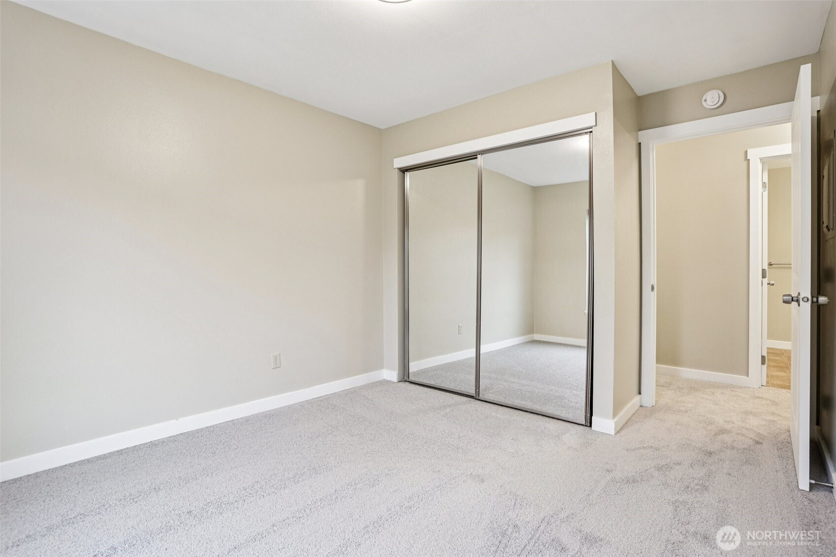12303 Harbour Pointe Boulevard, Unit W101 Mukilteo, WA 98275 - Photo 20 of 25 an empty room with sliding glass door