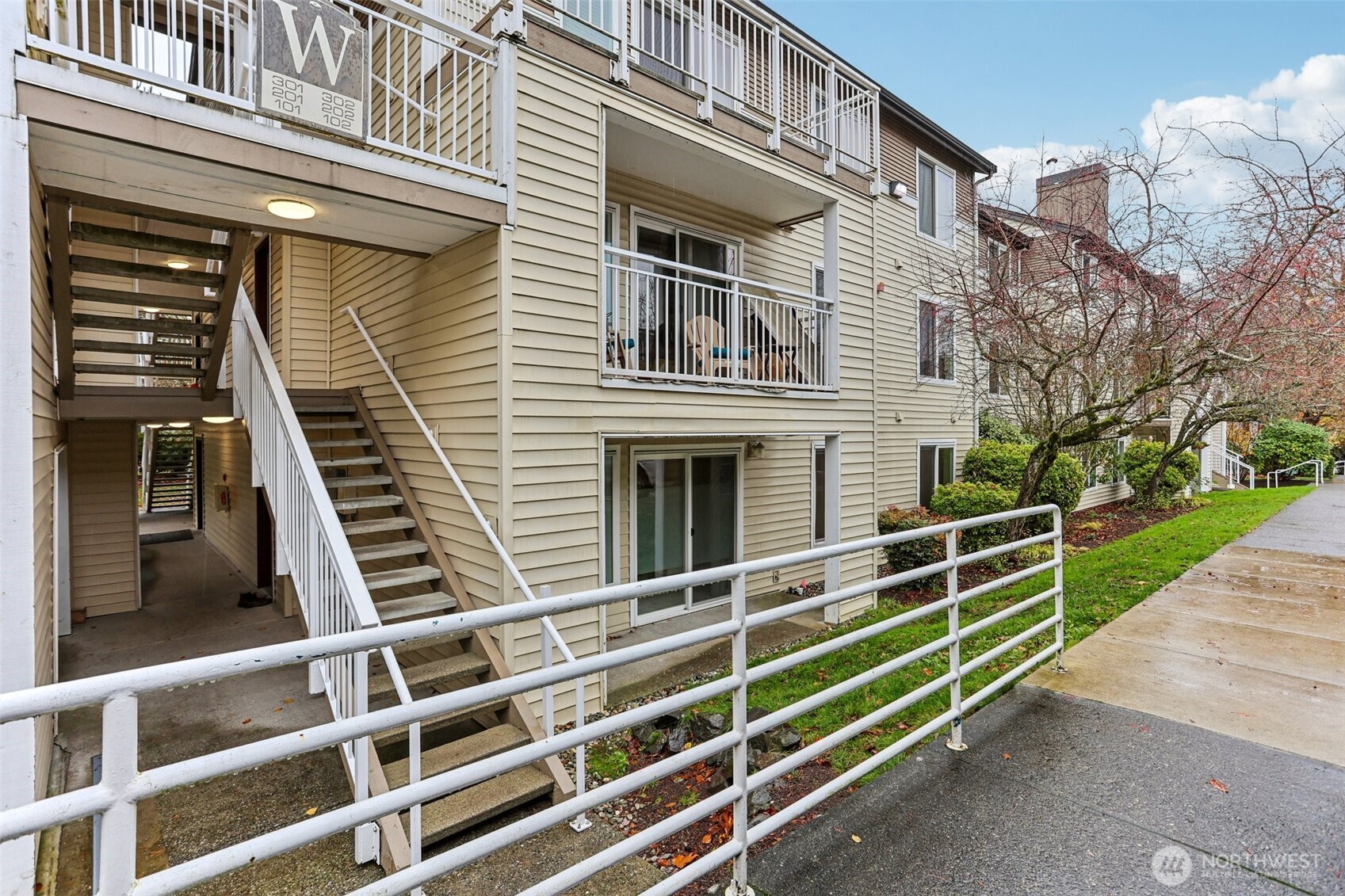 12303 Harbour Pointe Boulevard, Unit W101 Mukilteo, WA 98275 - Photo 2 of 25 a view of a balcony with stairs and wooden floor