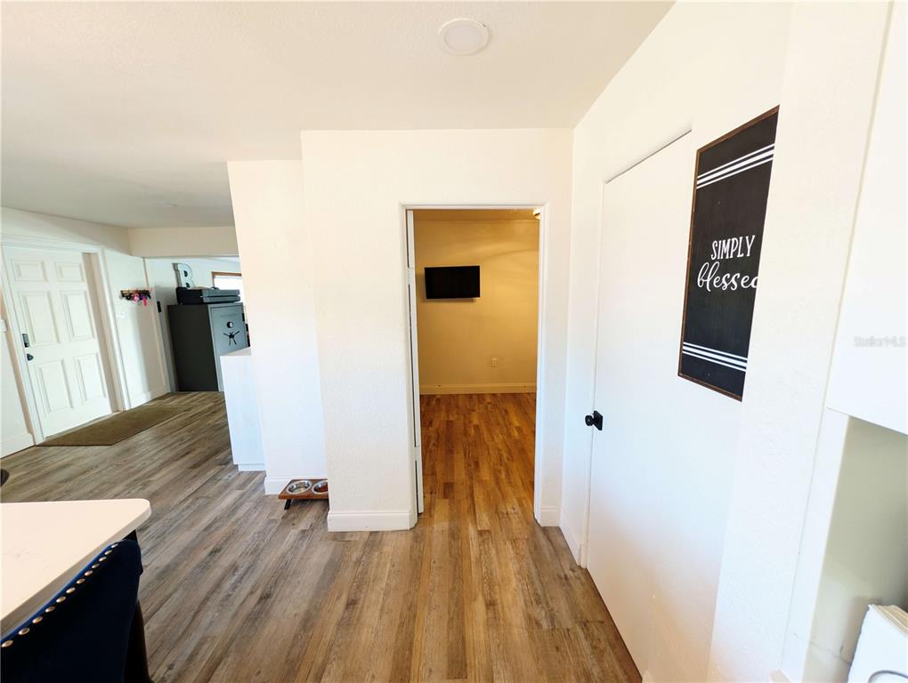 1007 77th Street East Palmetto, FL 34221 - Photo 18 of 39 a view of a hallway with wooden floor and staircase