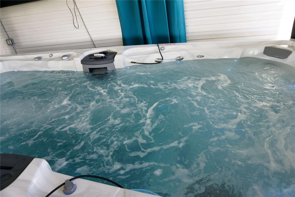 1007 77th Street East Palmetto, FL 34221 - Photo 23 of 39 a view of a backyard with table and chairs