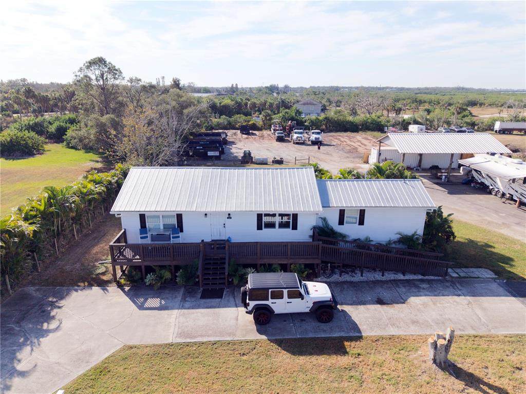 1007 77th Street East Palmetto, FL 34221 - Photo 3 of 39 a aerial view of a house with swimming pool and a terrace view