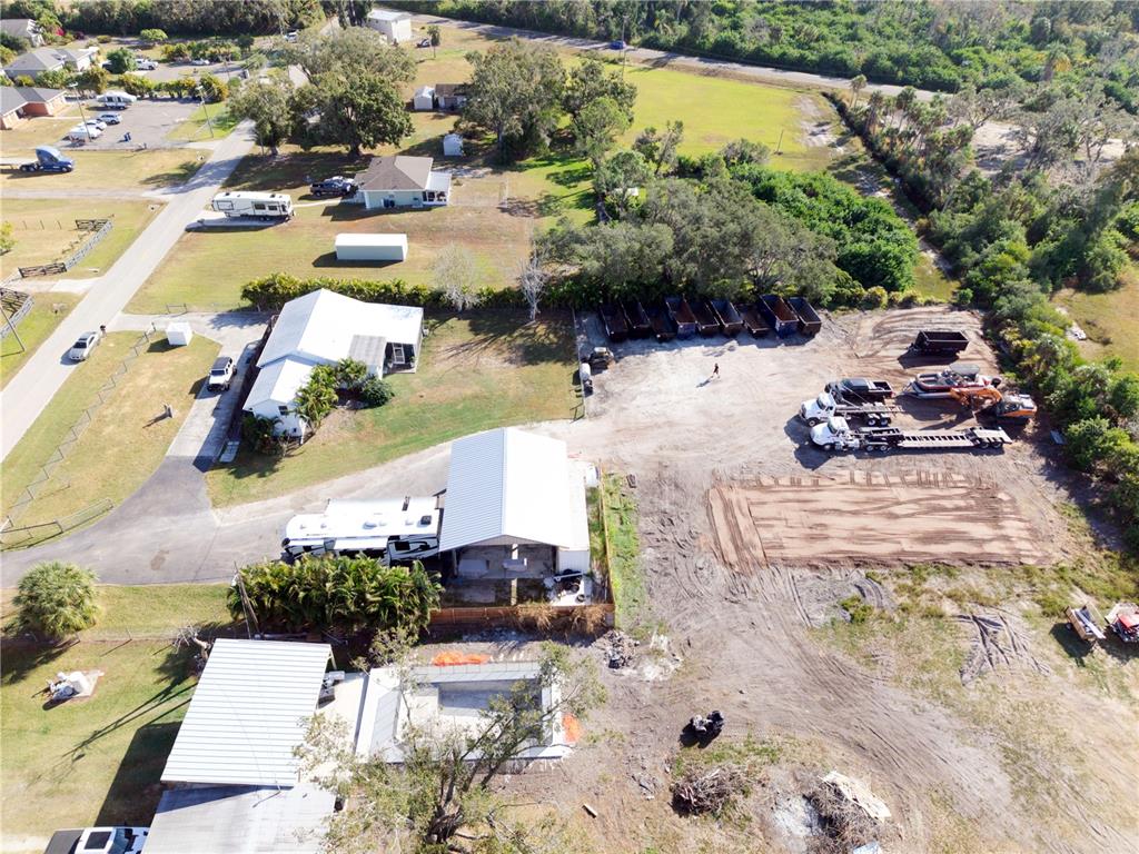 1007 77th Street East Palmetto, FL 34221 - Photo 36 of 39 an aerial view of a house with a yard and lake view