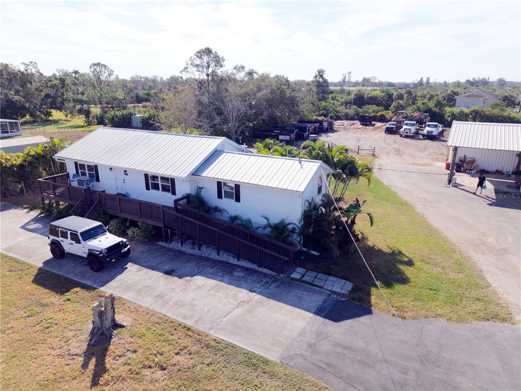 1007 77th Street East Palmetto, FL 34221 - Photo 38 of 39 a view of a house with pool and a yard