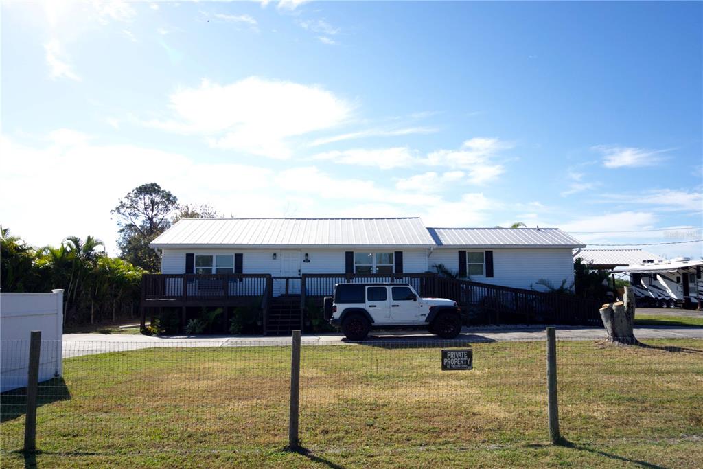 1007 77th Street East Palmetto, FL 34221 - Photo 5 of 39 a view of a swimming pool with furniture