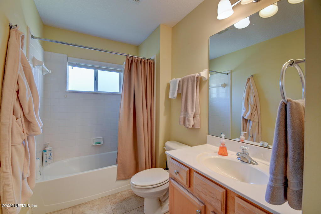 97071 Castle Ridge Drive Yulee, FL 32097 - Photo 16 of 26 a bathroom with a sink toilet and shower