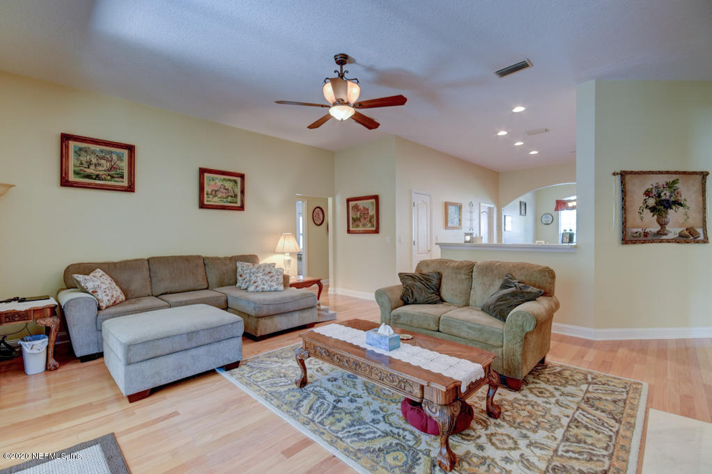 97071 Castle Ridge Drive Yulee, FL 32097 - Photo 21 of 26 a living room with furniture and a rug