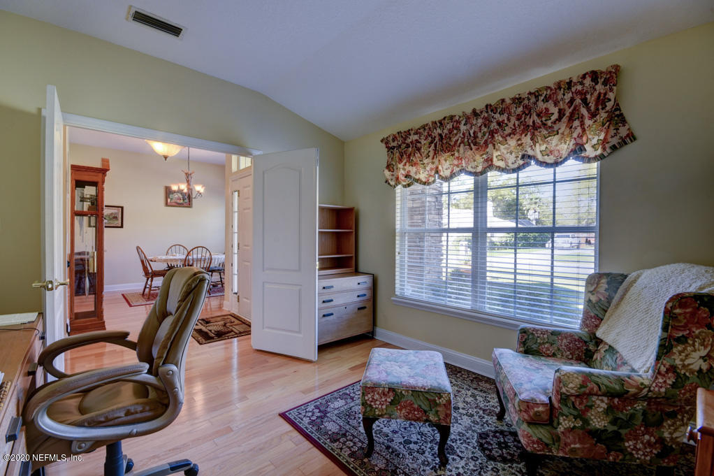 97071 Castle Ridge Drive Yulee, FL 32097 - Photo 6 of 26 a bedroom with furniture and a window