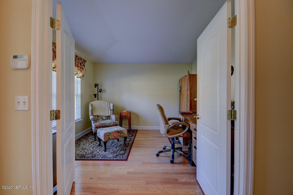 97071 Castle Ridge Drive Yulee, FL 32097 - Photo 7 of 26 a view of a hallway with couch and closet