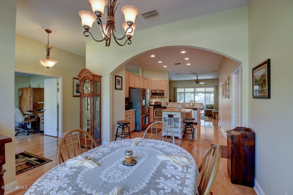 97071 Castle Ridge Drive Yulee, FL 32097 - Photo 8 of 26 a view of a dining room with furniture
