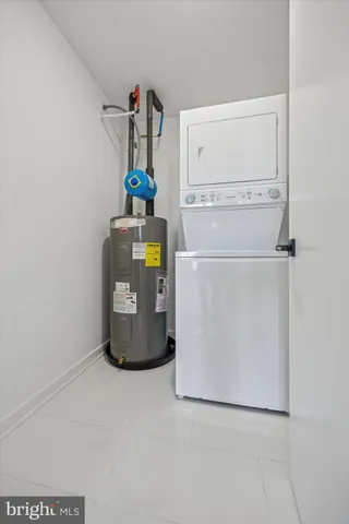 a room with a refrigerator and washer
