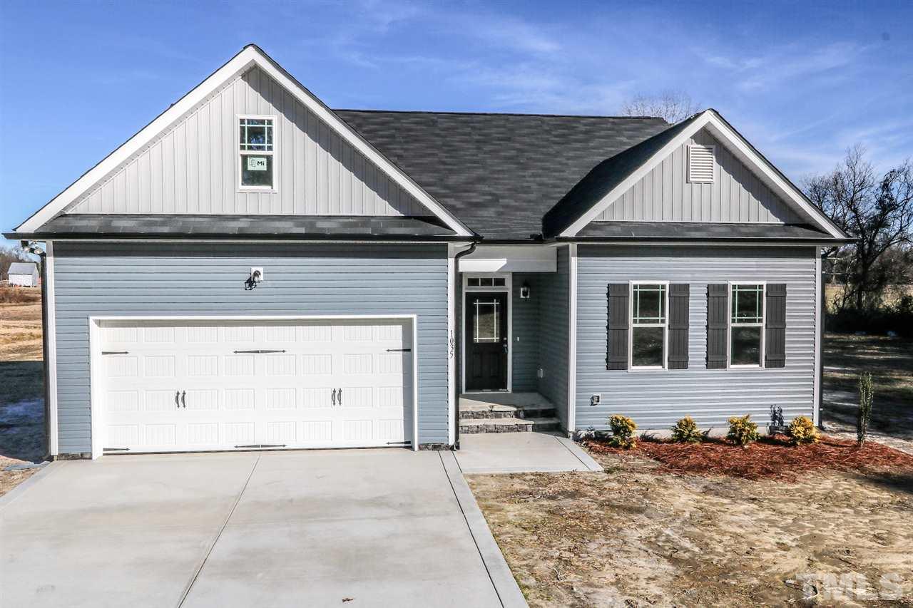 1035 2 Claude Road Willow Spring, NC 27592 - Photo 1 of 18 a view of a house with wooden fence