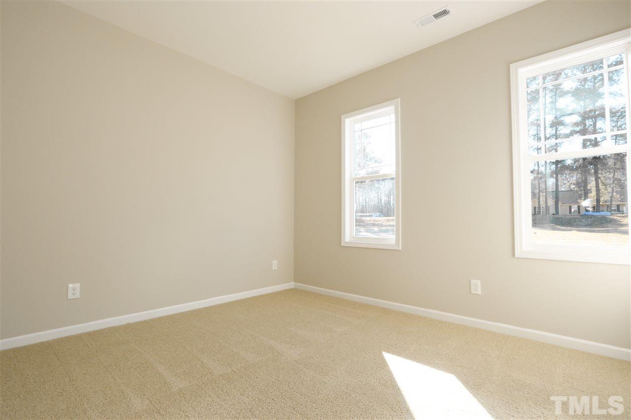 1035 2 Claude Road Willow Spring, NC 27592 - Photo 13 of 18 a room with a window