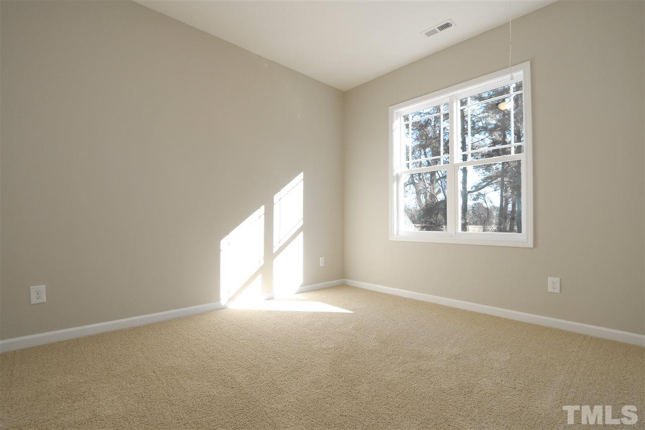 1035 2 Claude Road Willow Spring, NC 27592 - Photo 14 of 18 an empty room with windows