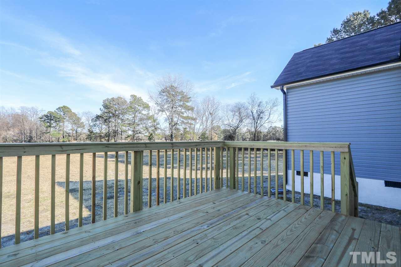 1035 2 Claude Road Willow Spring, NC 27592 - Photo 17 of 18 a view of balcony with wooden floor
