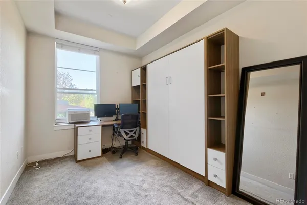 a view of workspace with wooden floor and window