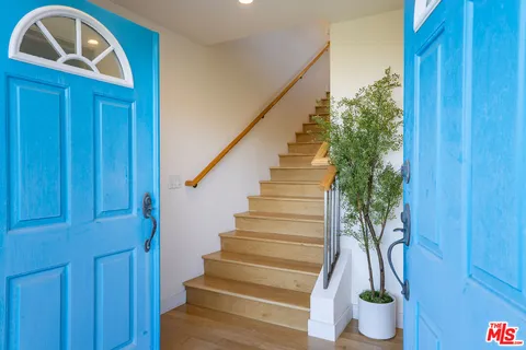 a view of entryway with wooden floor