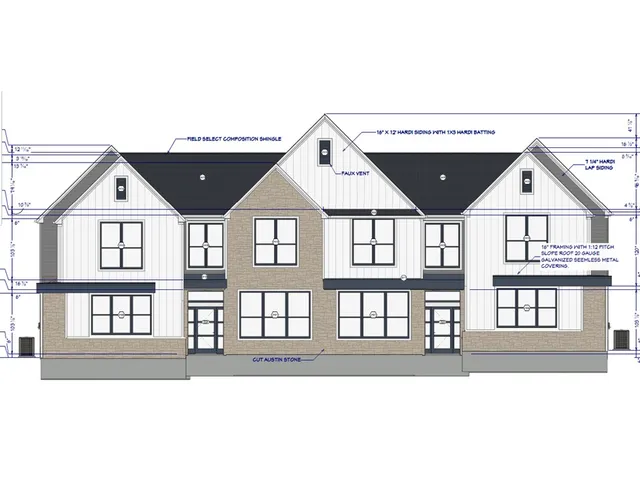 a front view of a house with a garage