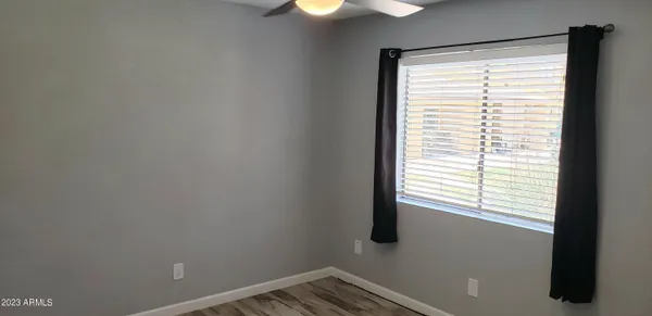 a view of an empty room with a window