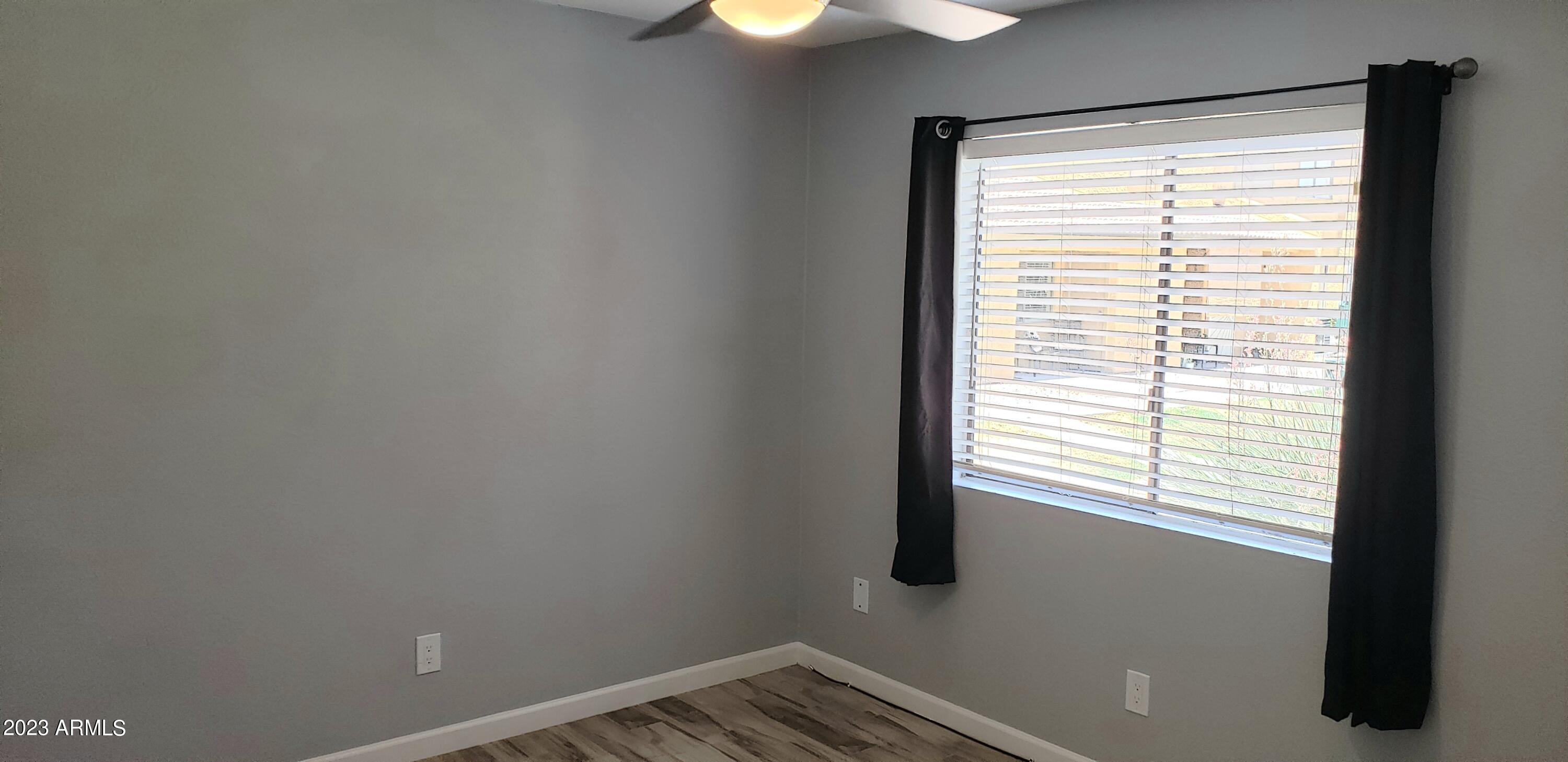 3511 East Baseline Road, Unit 1057 Phoenix, AZ 85042 - Photo 12 of 30 a view of an empty room with a window