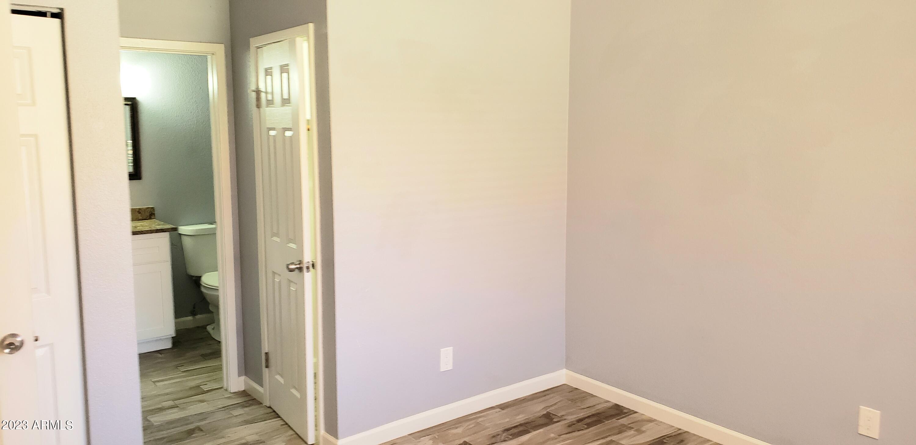 3511 East Baseline Road, Unit 1057 Phoenix, AZ 85042 - Photo 13 of 30 a view of a bathroom with a shower and a sink