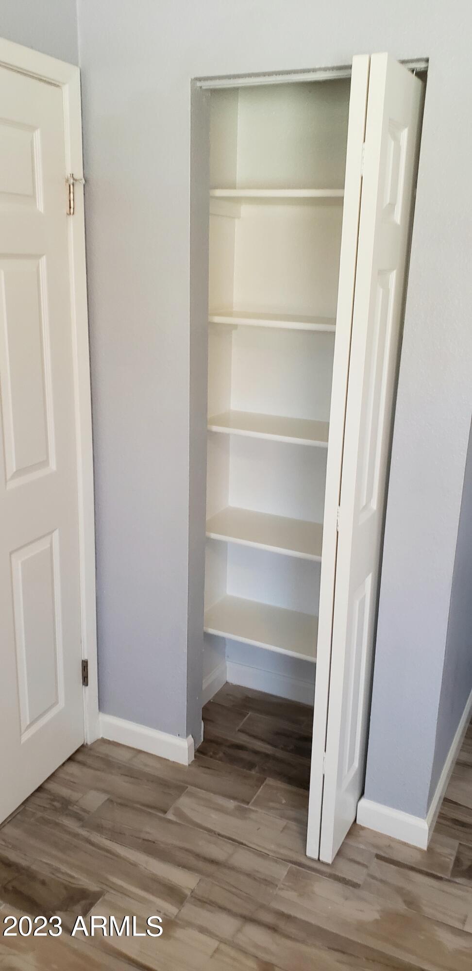 3511 East Baseline Road, Unit 1057 Phoenix, AZ 85042 - Photo 16 of 30 a view of walk in closet with empty racks